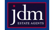 J D M